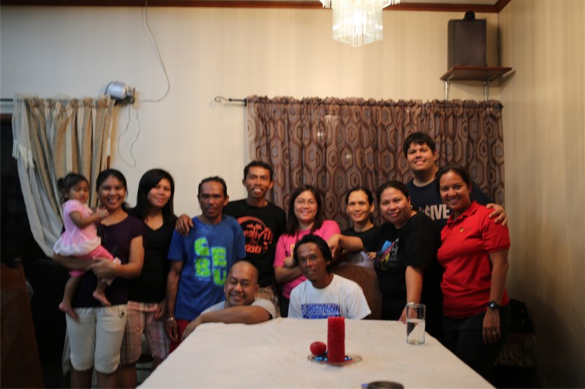 The rescued Filipino fishermen pose with the Filipino Community in Palau where they received care and assistance from the Adventist church and the Government of Palau. [photo by Eric Whipps]